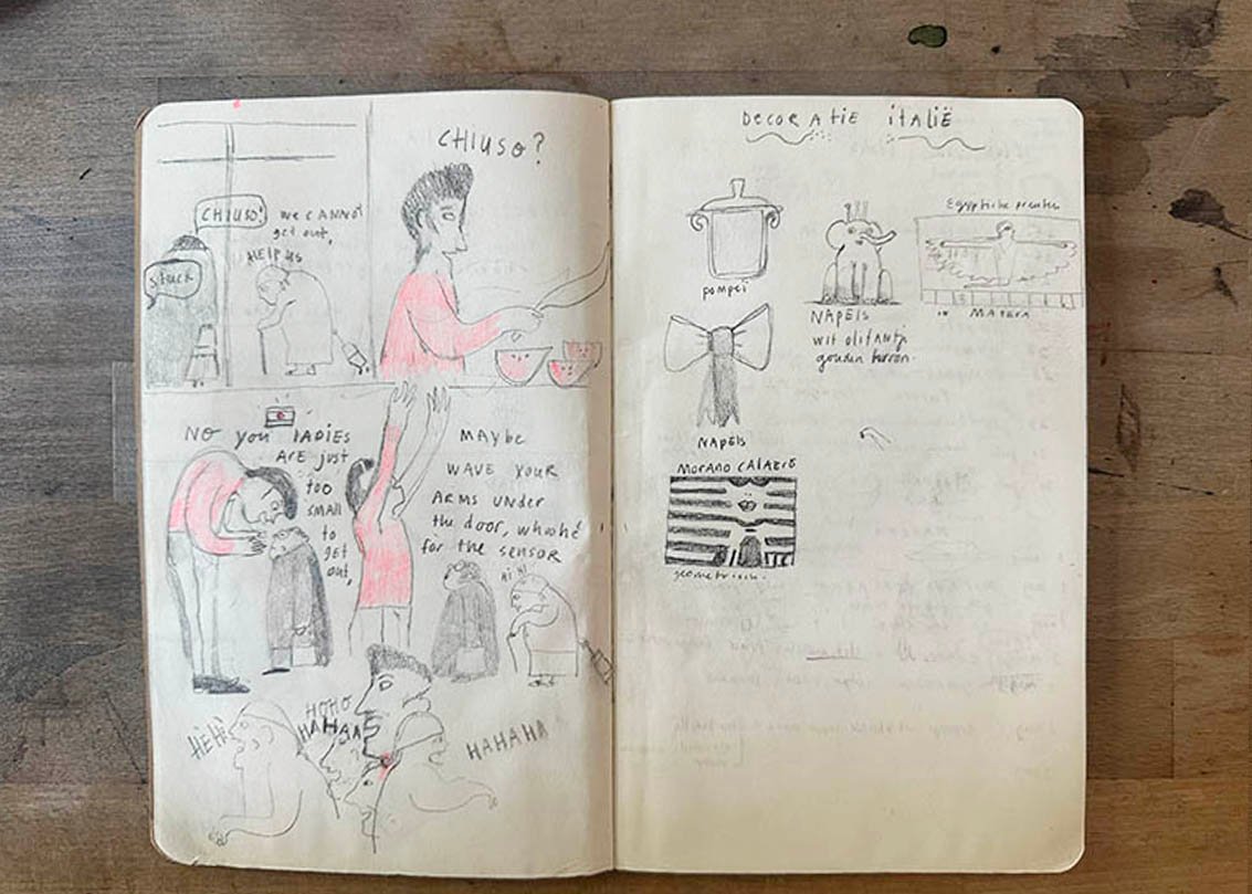 open sketchbook with comic sketch