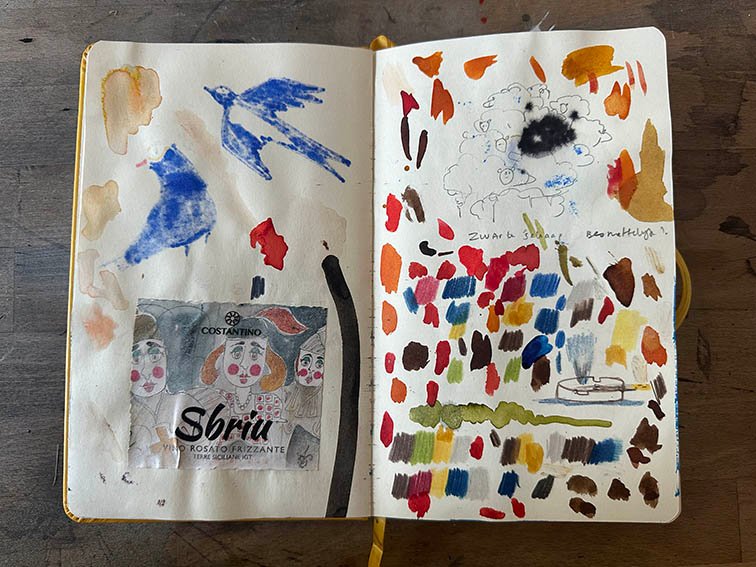 open sketchbook with colour try outs