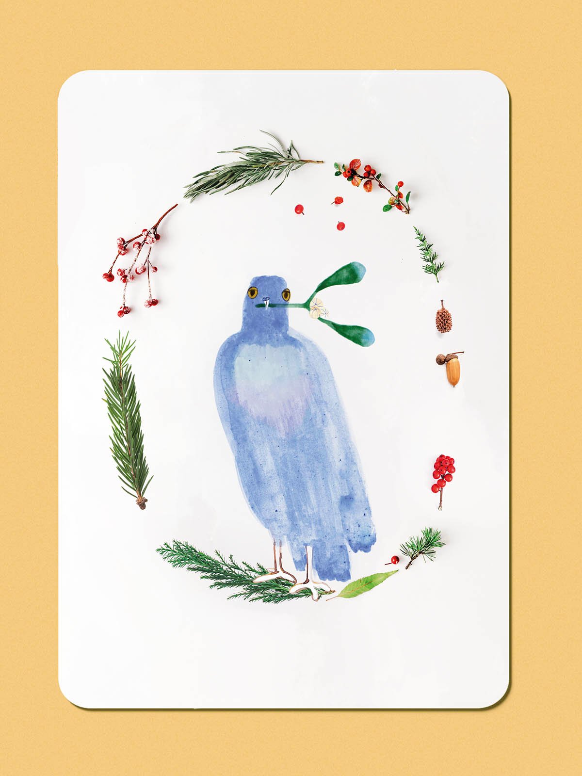 Illustrated Holidays Christmas greeting card featuring a blue dove carrying a sprig of mistletoe, surrounded by a wreath of colourful flowers and greenery.